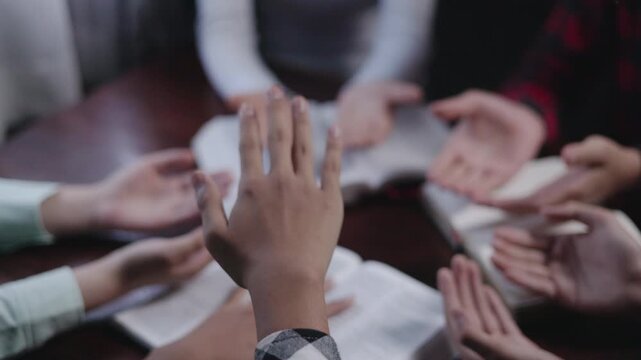 Group of Christians are congregants  to pray and seek the blessings of God, the Holy Bible. The cross symbol. They were reading the Bible and sharing the gospel, teamwork.