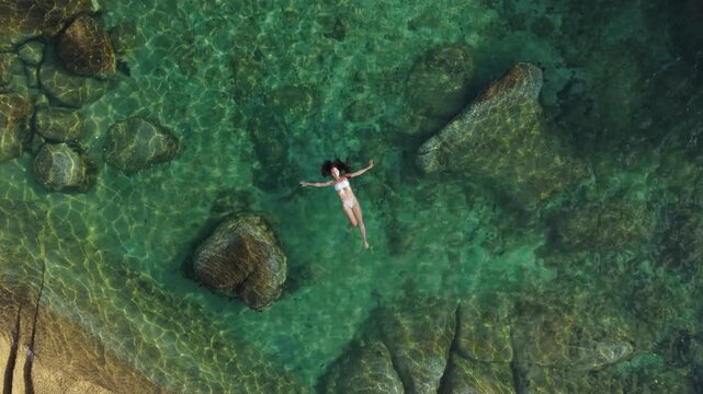 Woman Floating in Crystal Clear Turquoise Water Natural Rock Pool Ko Samui Thailand Aerial View