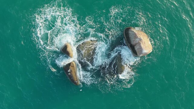 Aerial Top Down Abstract View of Granite Boulders in Turquoise Ocean Ko Samui Thailand
