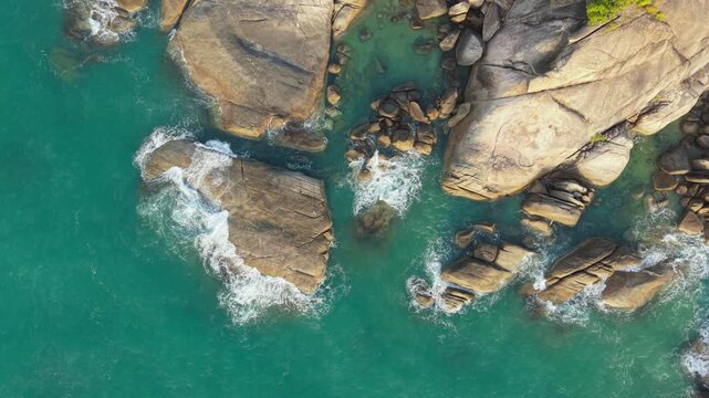Aerial Top Down View of Granite Rock Formation with Turquoise Water Channels Ko Samui Thailand