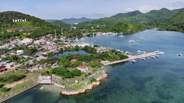 Aerial drone view of Fort Santa Isabel reveals the coral-stone Spanish fortress along Taytays tranquil coast, Philippines