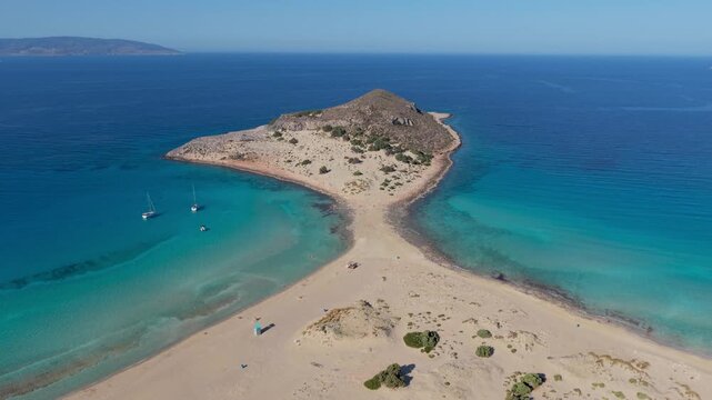 Experience the breathtaking views of Simos Beach, where golden sands meet crystal-clear waters on Elafonisos island Greece. Ideal for relaxation and exploration under the sun.