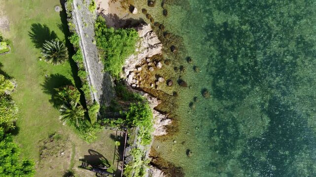 Aerial drone view of Fort Santa Isabel reveals the coral-stone Spanish fortress along Taytays tranquil coast, Philippines