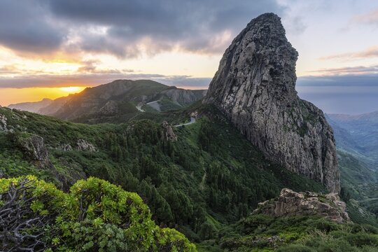 View of the Roque de Agando rock tower, one of La Gomera's landmarks, from the Mirador Roque de Agando. Sunrise, good weather. Monumento Natural de Los Roques, La Gomera, Canary Islands, Spain