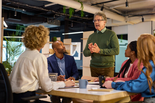 Multiethnic business people discussing project in a meeting room