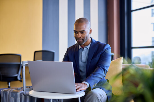 African american businessman working on laptop