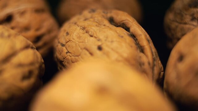 50p extreme close up shot of walnuts rotating to reveal natural texture