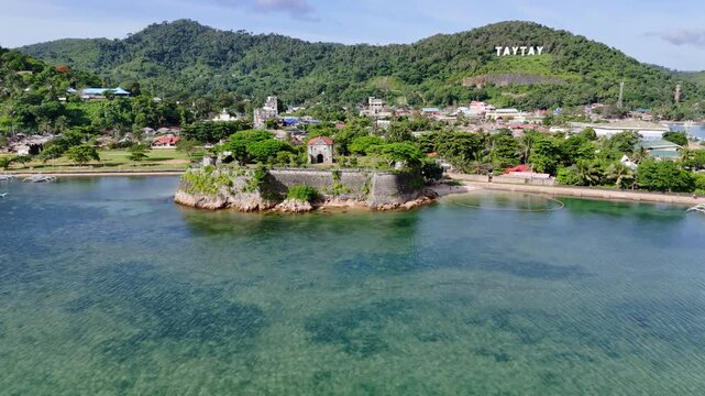 Aerial drone view of Fort Santa Isabel reveals the coral-stone Spanish fortress along Taytays tranquil coast, Philippines