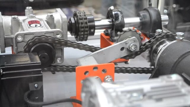 Industrial torque transmission mechanism, roller chains and sprockets for drive. Mechanical power transmission system. Drive sprockets and shafts. Drive roller chains for torque transmission. Industry