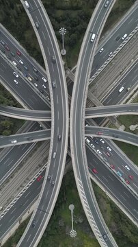 Vertical Aerial View of Highway Interchange and Traffic at Dusk