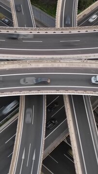 Vertical Aerial View of Highway Interchange and Traffic at Dusk