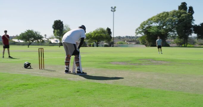 On bowler delivery batsman defending running, while wicketkeeper removing bails for runout