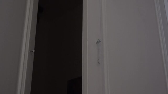 person removing and putting the metal latch on a door. High quality 4k footage