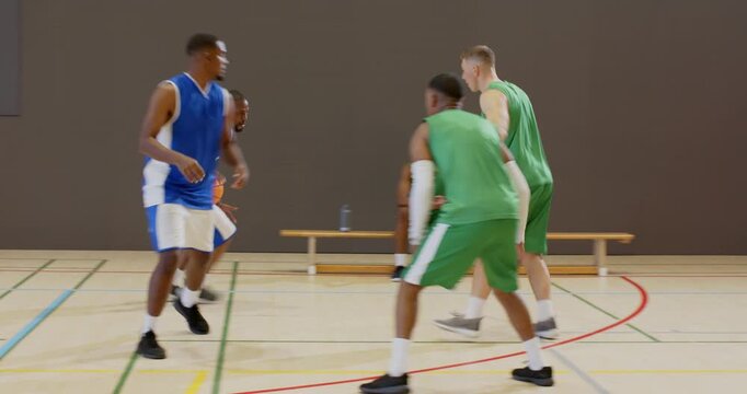 Responding to clap african american player wearing jersey 5 executing ball crossover layup on court