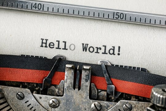Close-up shot of an vintage typewriter with 'Hello World' typed out, great for technology or nostalgia themes