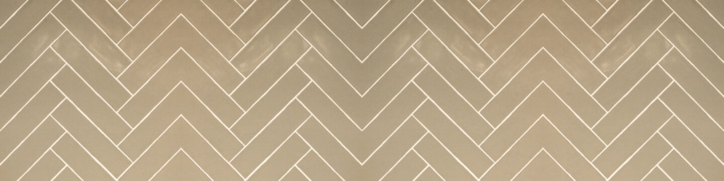 Tile background - Bright beige abstract grunge herringbone tiles texture banner panorama long, seamless pattern