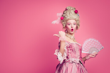 Fototapeta premium Photo of surprised shocked lady wearing classic renaissance dress corset point finger empty space isolated pink color background