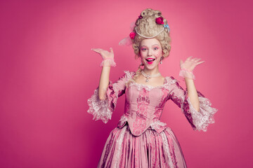 Fototapeta premium Photo of positive baroque style lady monarch feel happy raise hands up wearing antique style outfit isolated pink color background