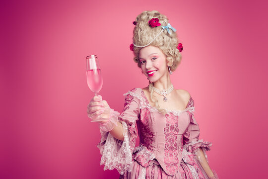 Photo of happy attractive lady dressed baroque costume enjoying champane copy space isolated pink color background