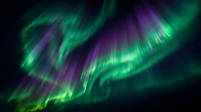 Vibrant aurora borealis display over dark landscape northern lights