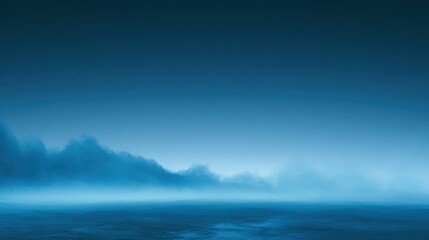 Fototapeta premium Dawn over peaceful ocean waters. Gentle fog drifts across tranquil blue sea. Quiet early morning scene with mist and calm waters. Calm dawn scene with misty horizon and soothing shades of blue
