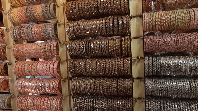 Display of Indian traditional Colorful bangels at the street market. Background of colorful bangles. Shops in Commercial Street Bangalore Bengaluru India
