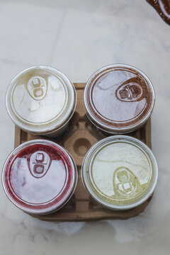 Top Down View Of Four Plastic Cups Filled With Assorted Blended Beverages