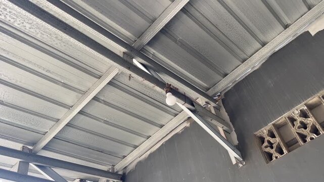 Silver Galvalume Steel Roof Installation On Residential House