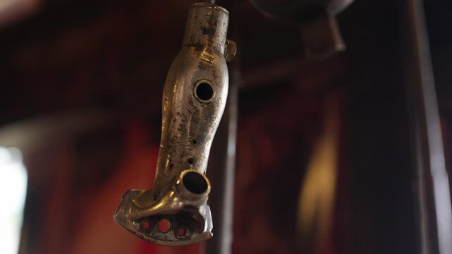 Traditional gaucho horse riding stirrup with silver ged surface inside rustic Patagonian estancia in Argentina, highlighting equestrian heritage, ranch craftsmanship and cowboy equipment, closeup