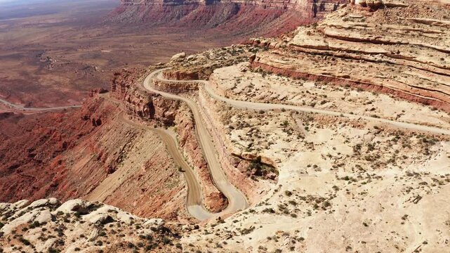 Moki Dugway road revealing drone aerial shot in southeastern Utah.