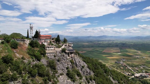 Axion Esti Monastery in Paggaio Mountain Greece, Aerial Point of Interest Shot of Orthodox Monastery and Falakro Mountain in Background