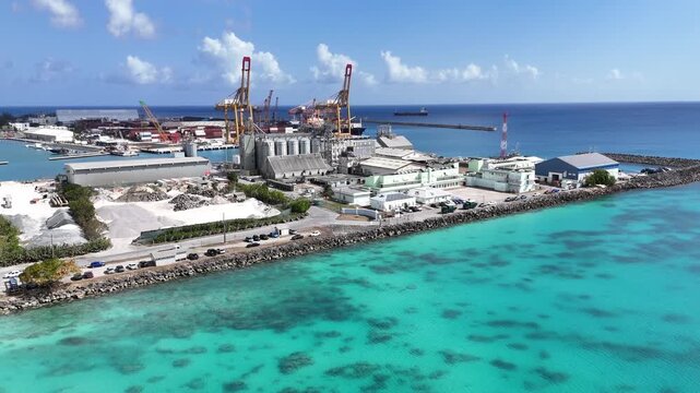 large luxury cruise ships docked at the deep water harbor terminal pier next to turquoise coastal waters in Carlisle Bay, Bridgetown destination, Barbados