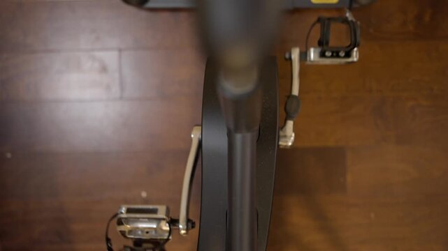 Stationary exercise bike pedals for indoor home gym training scene