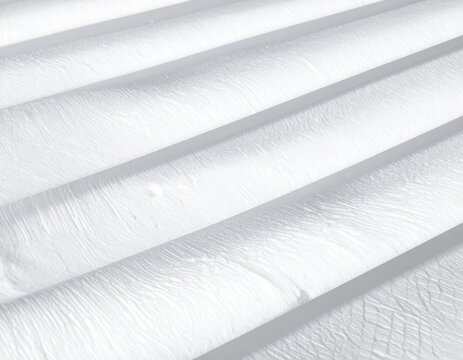 Clean, abstract white folds with subtle textures and shadows creating depth