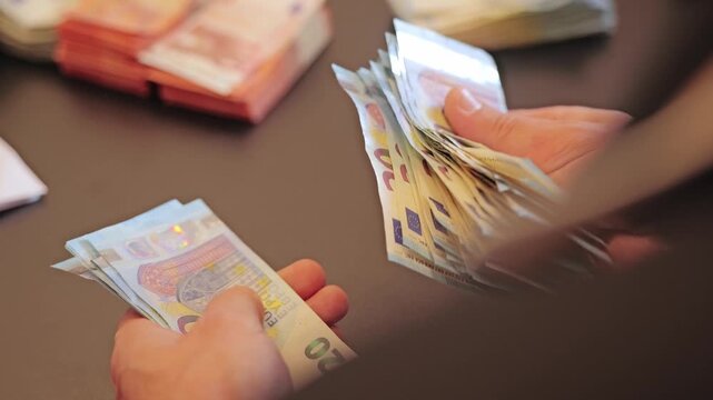 Slow motion budgeting scene reflects inflation pressure and financial anxiety