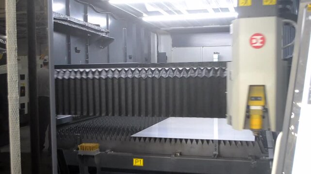 Industrial fiber laser cutting machine for metal, high-precision sheet metal processing. Laser metal processing. Laser machine. Industry. Industrial machine. Industrial background