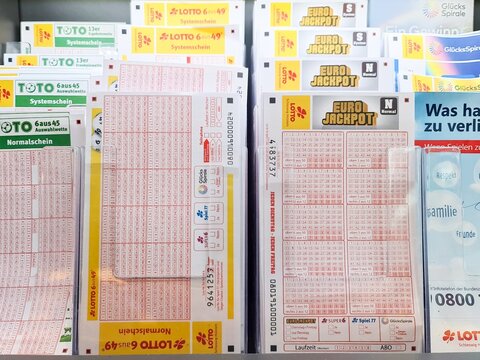 Hamburg, Germany - 06. June 2026: Lottery tickets and forms in a shop display
