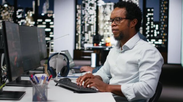 Software developer in company workplace doing artificial intelligence tech quality assurance. IT startup employee in office typing on keyboard, writing AI script with programming languages.