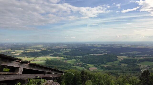 Scenic panorama from Grosser Buechlstein near Grattersdorf overlooking forests, farmland and rolling hills in Lower Bavaria on a clear day.