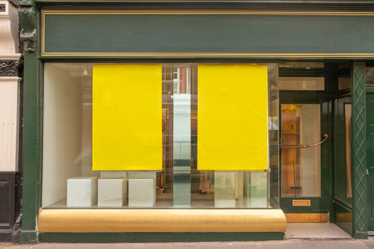 LONDON - Shop window with yellow blank signs on retail front