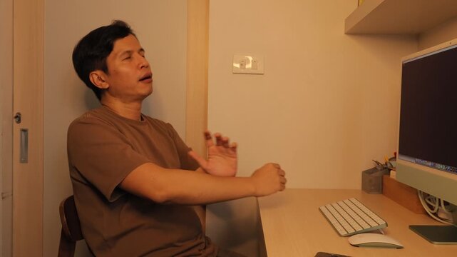 Office Worker Stretching at Desk During Work Break