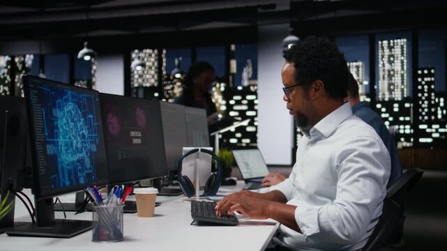 Engineer in office receiving critical error warning while writing code. worker in Silicon Valley startup using PC to troubleshoot software glitches, resolving system crashes for coding workflows.