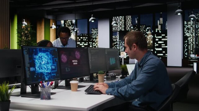 Software developer in office receiving critical error warning while writing code. Tech agency employee using PC to troubleshoot software glitches.
