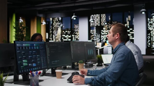 Programmer typing complex code on computer, developing machine learning models to automate business tasks in workspace with coding and programming workflow.