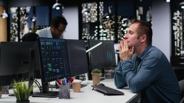 Stressed IT professional in company workplace pleased after fixing glitches, doing artificial intelligence tech quality assurance. Anxious admin in office satisfied after being helped by AI.