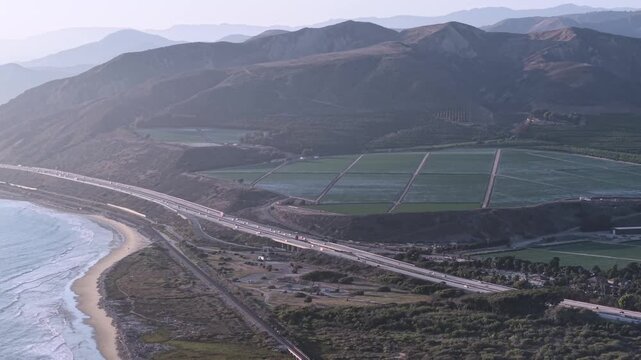 180 View of PHC Pacific Coast Highway, Southbound pan through Ventura California. Scenic Coastal Landscape, wide shot of mountains, city and beaches