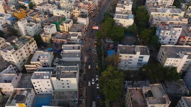 residential buildings terrace with narrow road and moving vehicles at manikonda, hyderabad, telangana, india. day time, push in shot, drone shot, 4k.