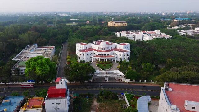 Karnataka State Open University Entrance with Vijnana Bhavan, Cricket ground and mysore highway at musuru, karnataka, india. day time, push in shot, drone shot, 4k.