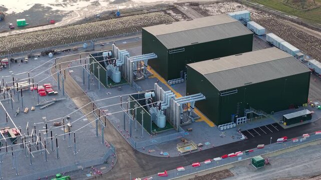 High angle aerial drone view of synchronous condensers and critical grid infrastructure at Walpole substation United Kingdom