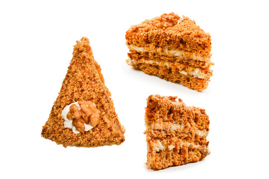 Peace of honey cake isolated on white background.